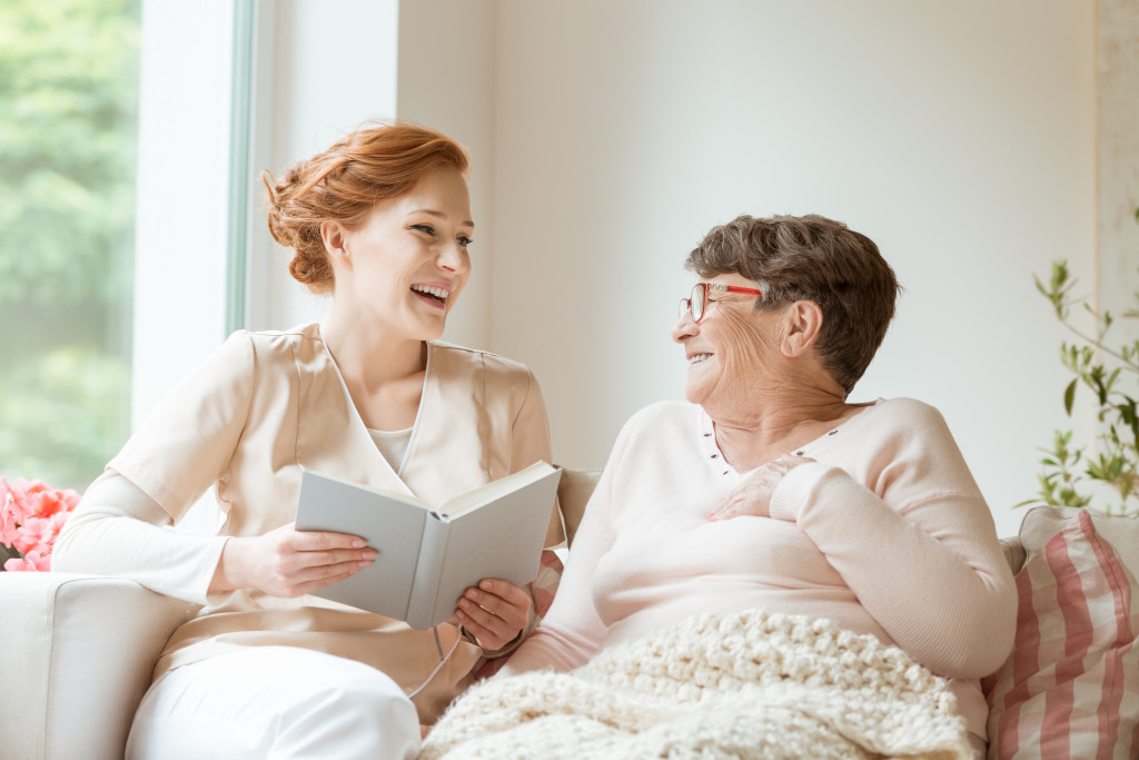 woman telling a story to an elderly woman