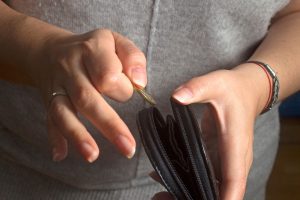 person holding a coin