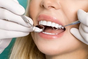 woman getting her teeth checked