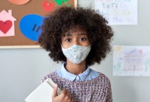 A child wearing face mask in school