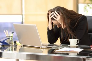 businesswoman feeling stressed or anxious at work