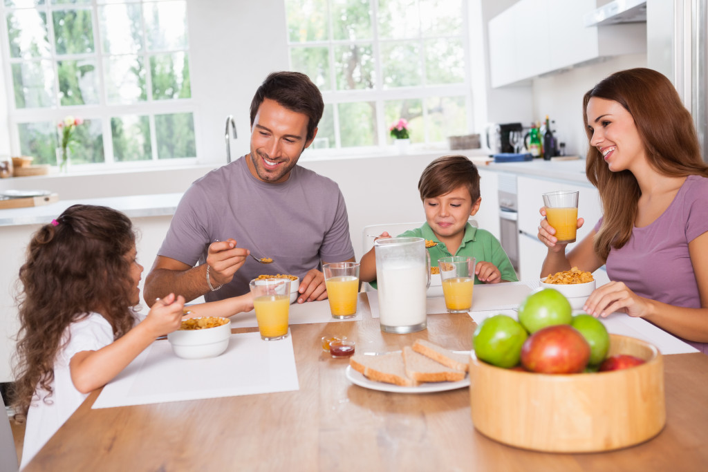 Family eating healthy breakfast in kitchen
