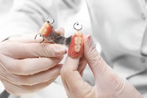 dentures held by dentist