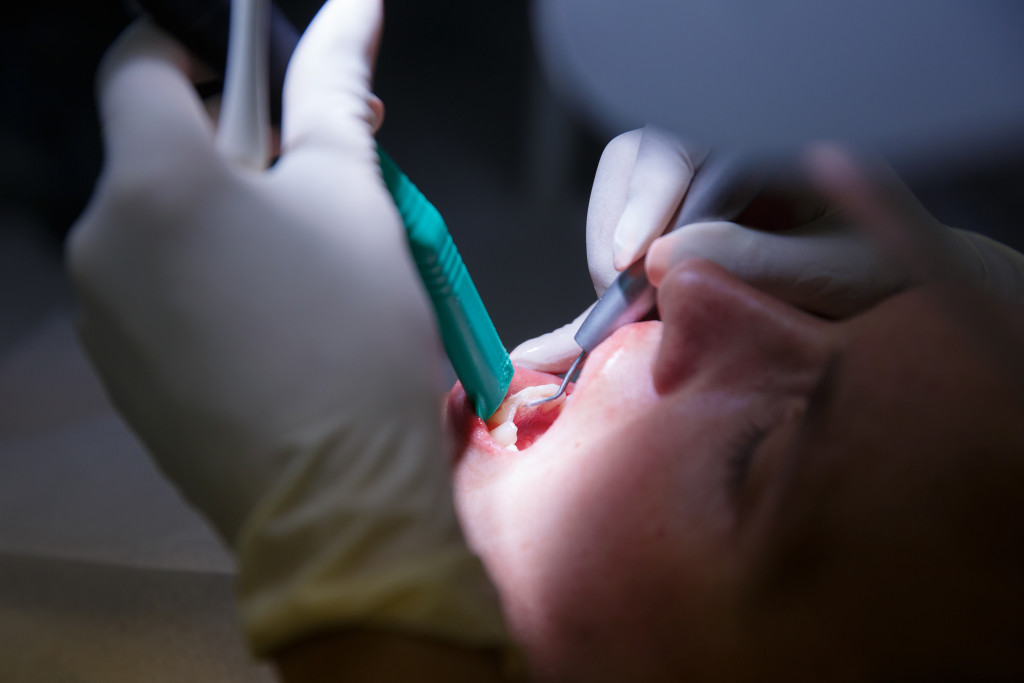 female patient at dentist's office having cleaning or procedure 