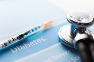 A diabetes test, a stethoscope, and a syringe
