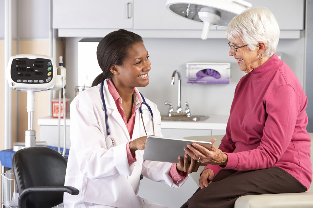 A doctor talking to a senior patient