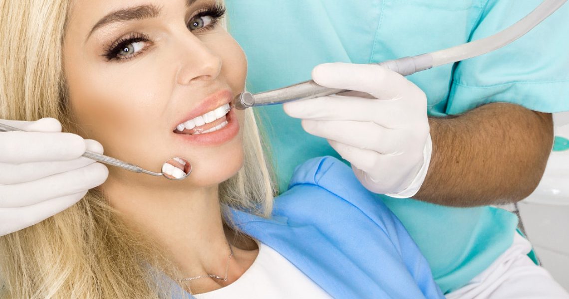 woman having her teeth checked by the dentist
